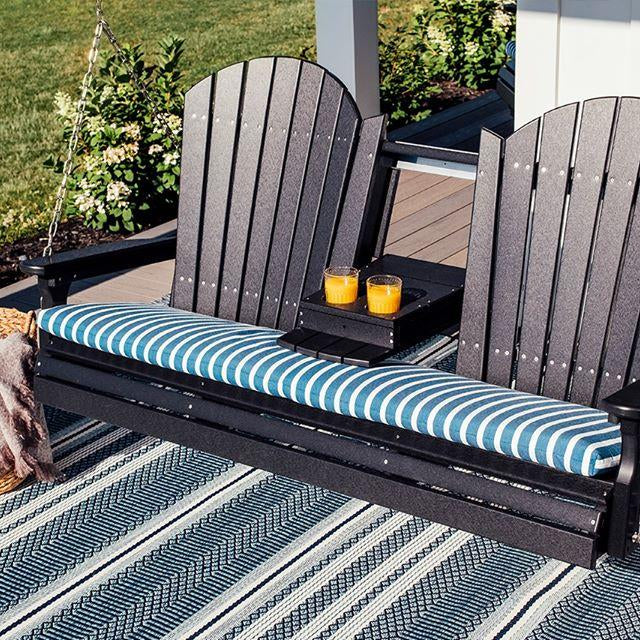 LuxCraft Adirondack 5ft recycled plastic porch swing hanging on a front porch