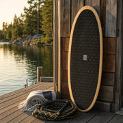 Shore Thing Wake Surfboard – Paulownia on a lake dock at golden hour (AI-generated visualization)