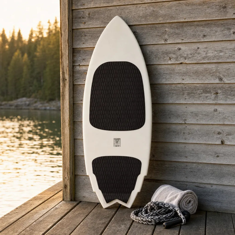 Smoke Show Wake Surfboard – Carbon Fiber BPT 2025 on a lake dock at golden hour (AI-generated visualization)