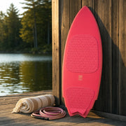 Smoke Show Wake Surfboard – Hot Pink on a lake dock at golden hour (AI-generated visualization)