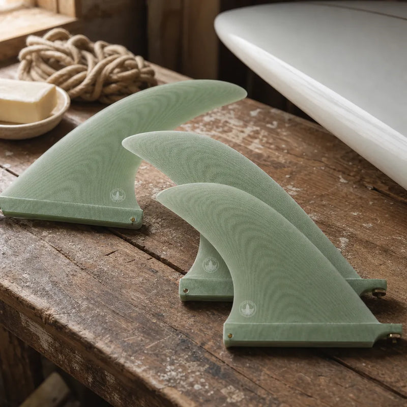 STCo. Volan Nose Rider Fin styled on a shaping bench (AI-generated visualization)